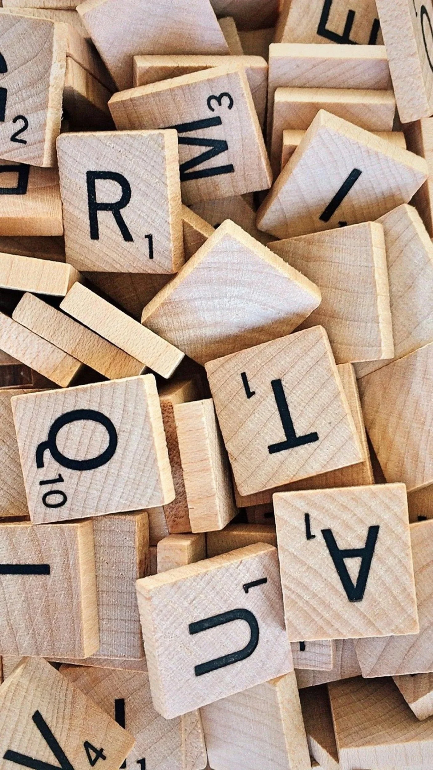 A pile of wooden scrabble pieces