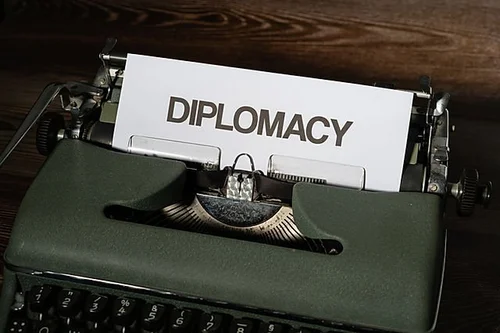 Vintage typewriter typing the word Diplomacy
