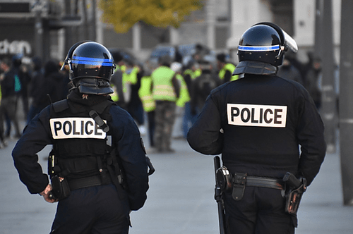 Police officers in tactical gear at an event