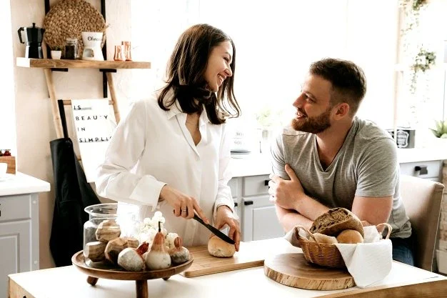 Young couple cooking together in a bright kitchen
