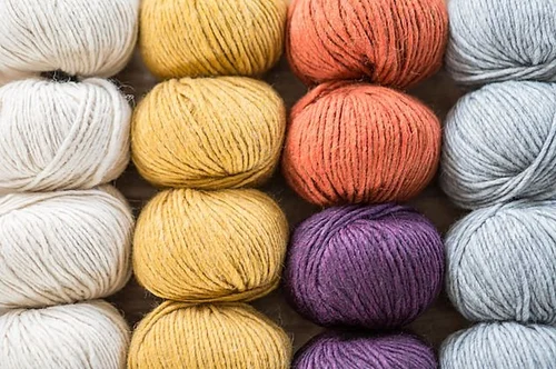Rows of colorful yarn balls