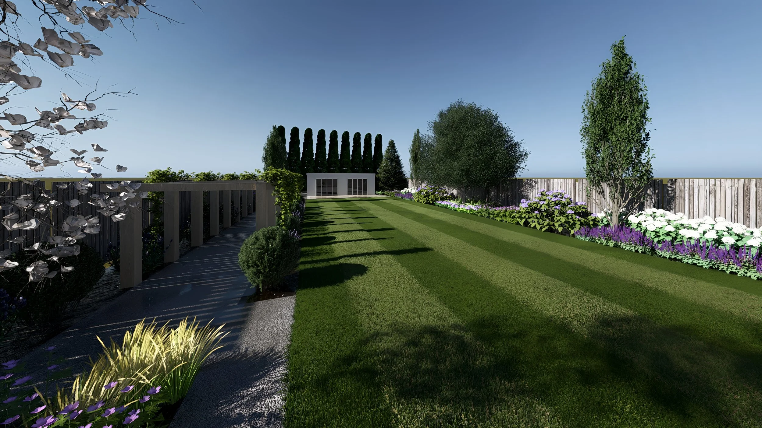 A landscaped backyard garden with a manicured lawn, flower beds with purple and white flowers, trees, and a wooden fence under a clear blue sky.