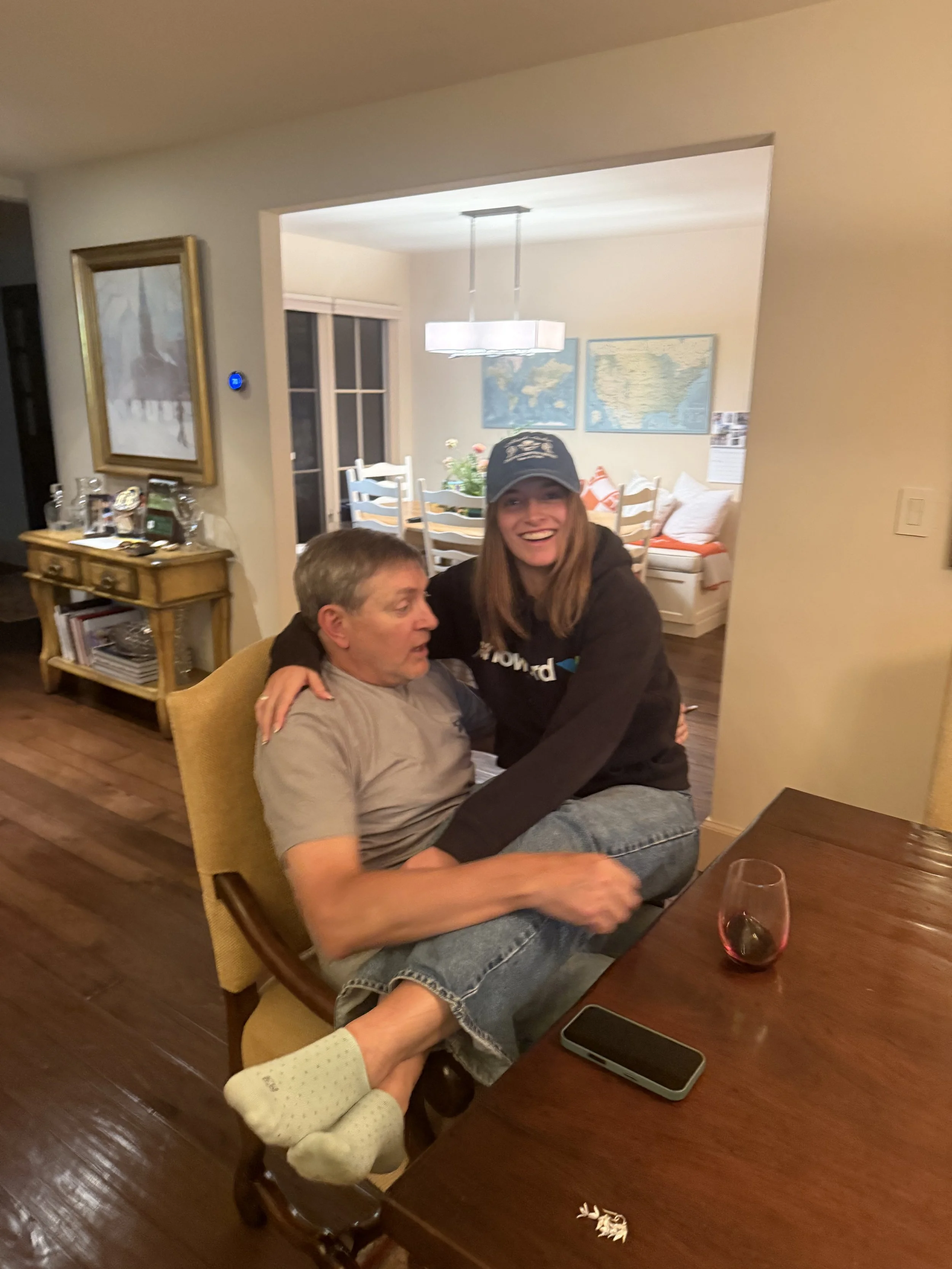 Alyssa and her dad (he was not happy about her sitting on him)