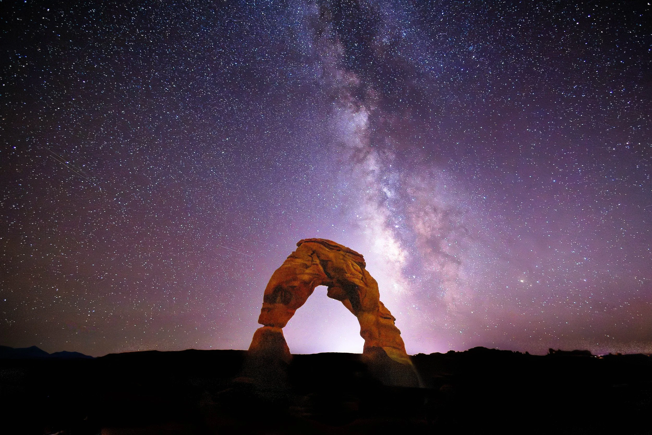 Delicate Arch under the Milky Way in Arches National Park Utah Moab.