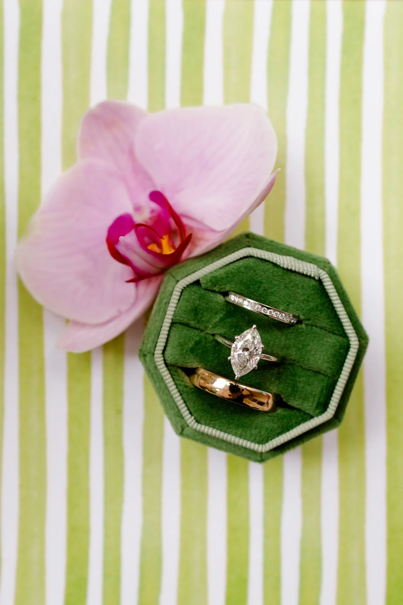 Flatlay Wedding Rings Green and Orchid.
