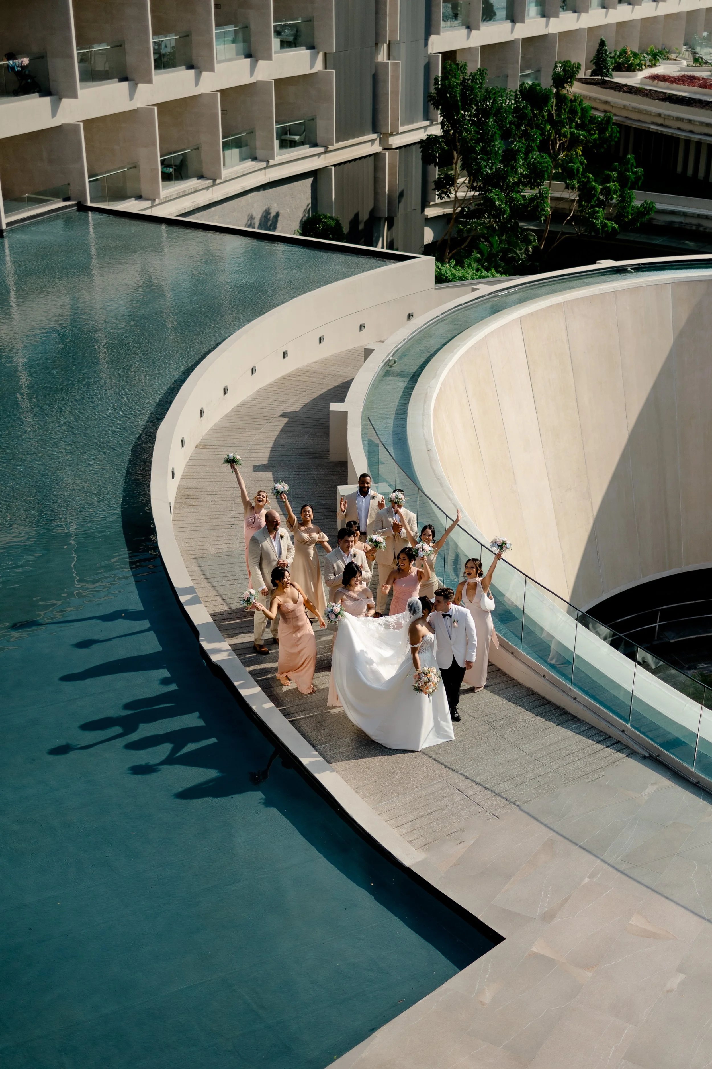 wedding party walking mexico shadow pool 