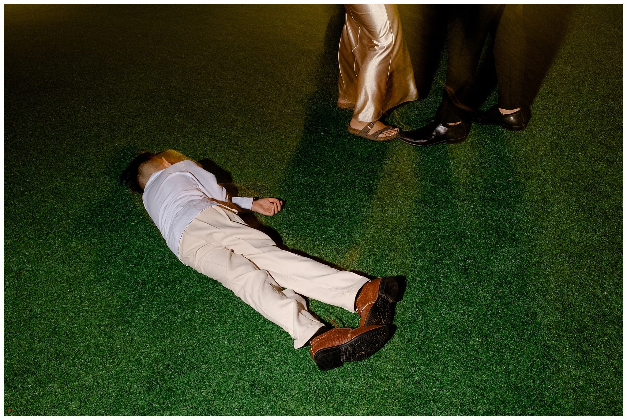 Flash Nightime photo of child sleeping on grass at reception