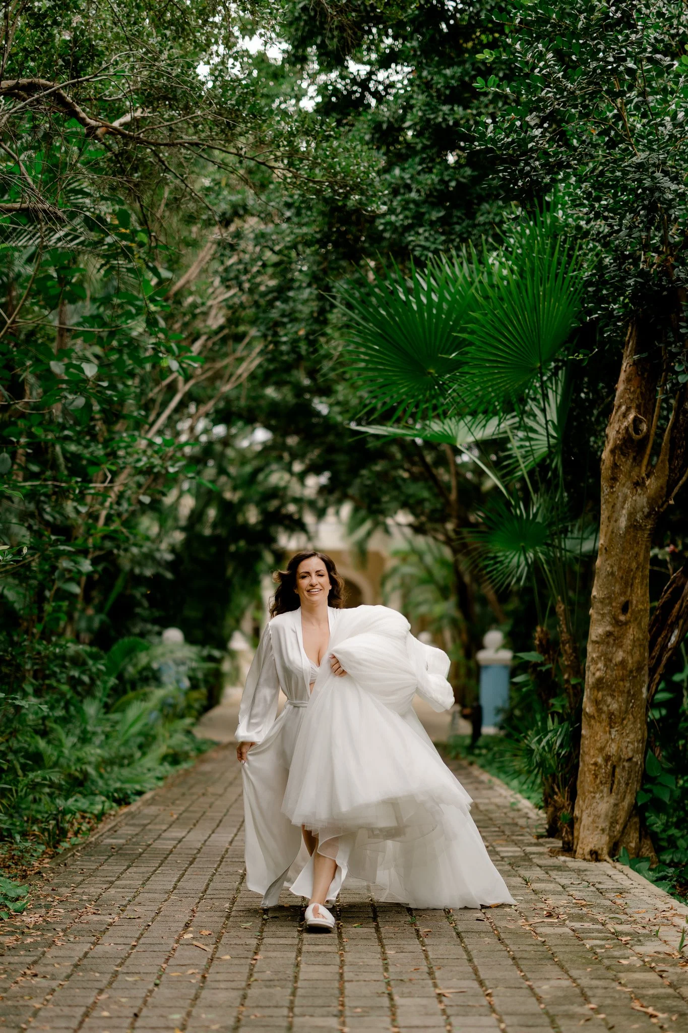 Bride Running with wedding Dress Tulum Mexico Tropical Forest.