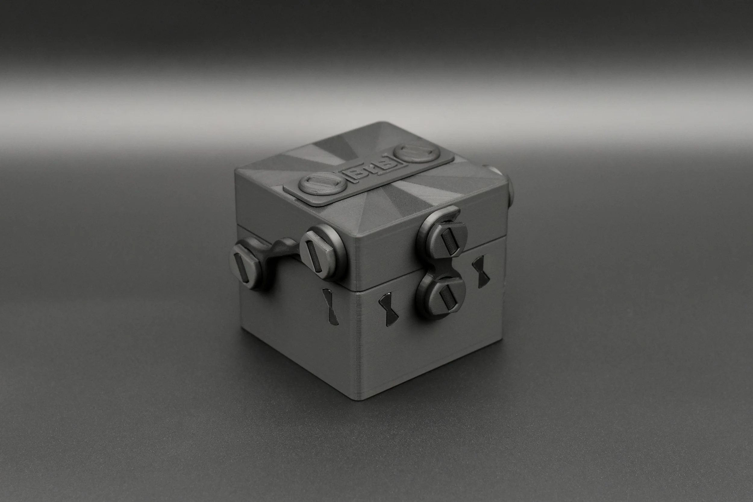 A closed Token Box in the all-black Blackout finish, highlighting its secure latch system and durable, compact design.