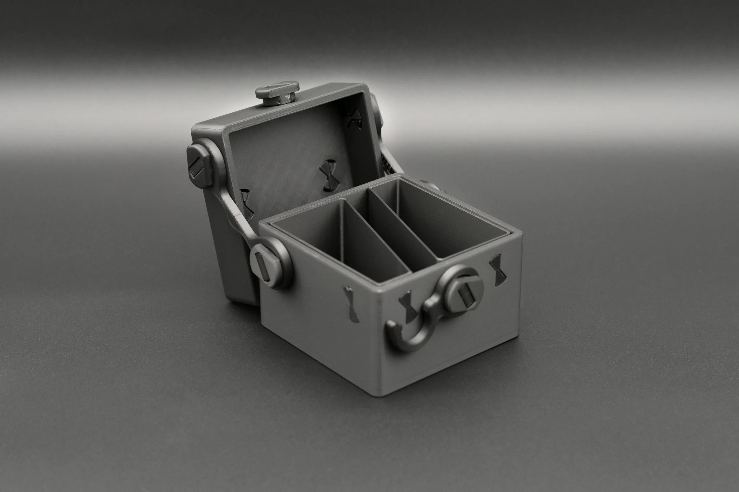 An open Blackout Token Box revealing the internal compartments engineered to organize token cards, dice, and counters.