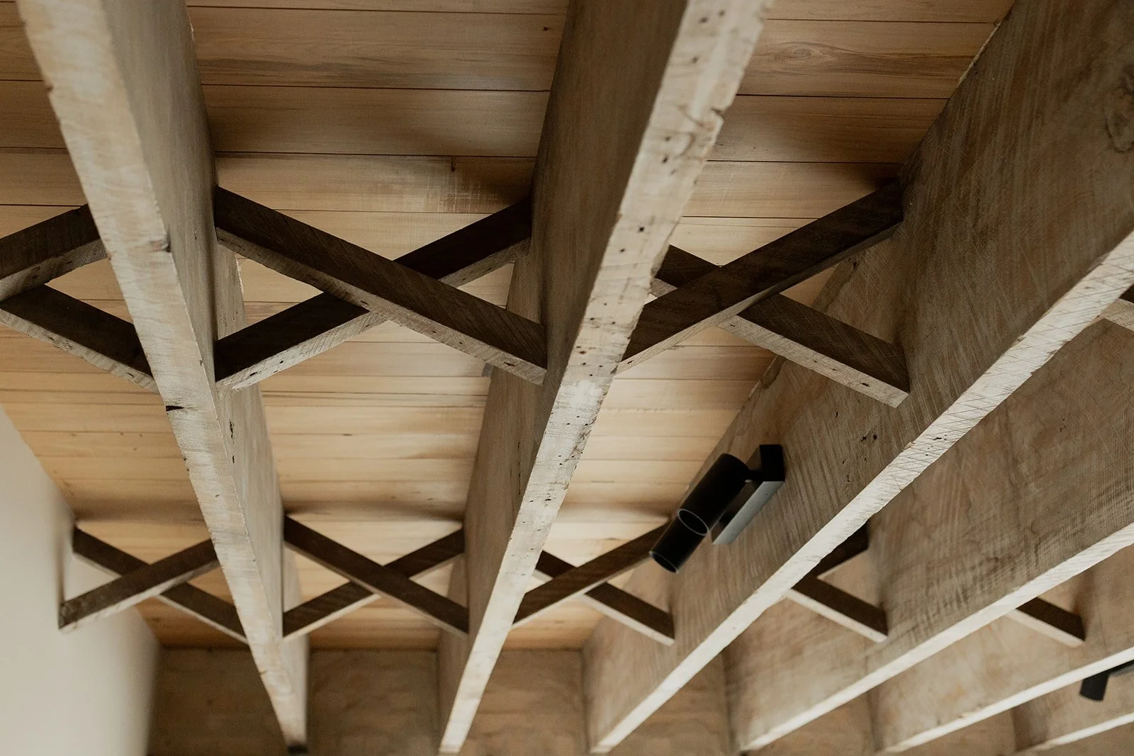 Little wooden houses on a furniture top.
