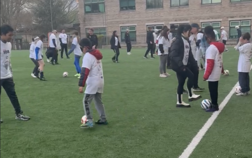 kids playing soccer at open clinic
