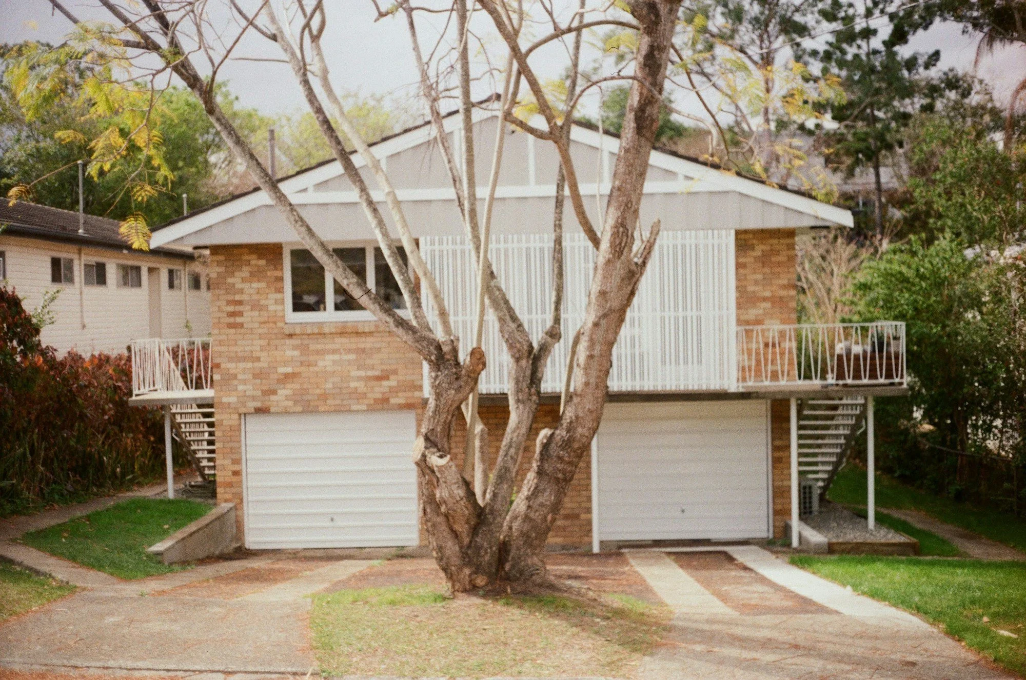 House on a sloping street with the garage on the lower level