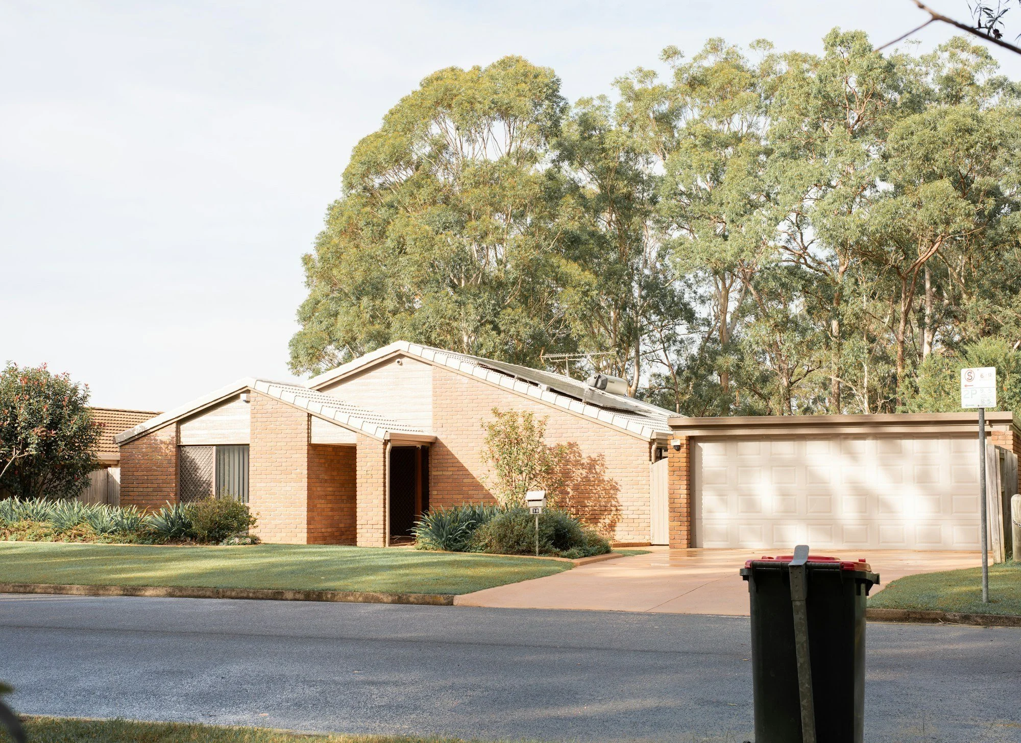 Single storey brick house on a suburban block