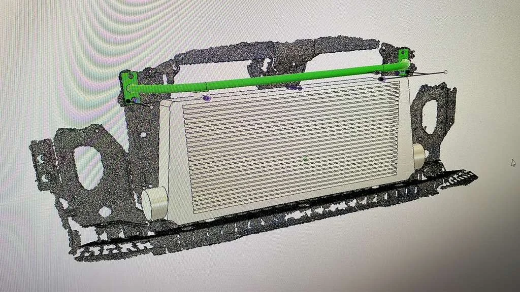 3D rendering of a mechanical component with a radiator, green support bar, and mounting brackets.