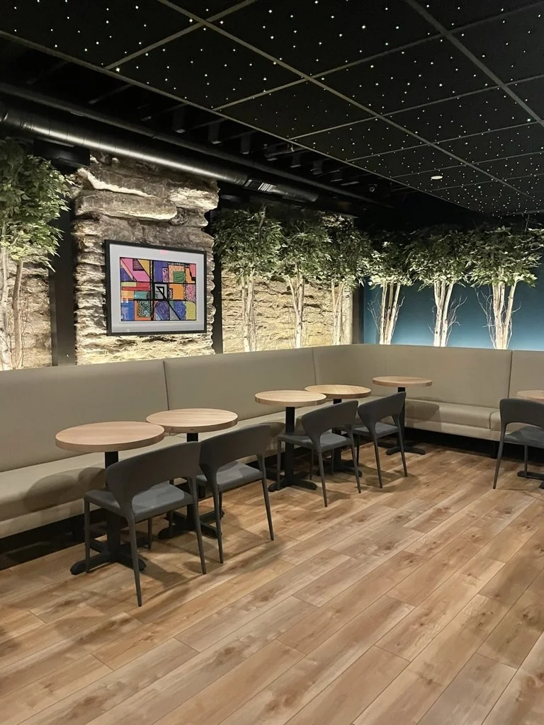 Commercial restaurant modern electrical lighting and fixture installation by Walter Electrical Contractors in Minnesota, featuring pendant lights, recessed lighting, and window-area illumination in a modern restaurant.