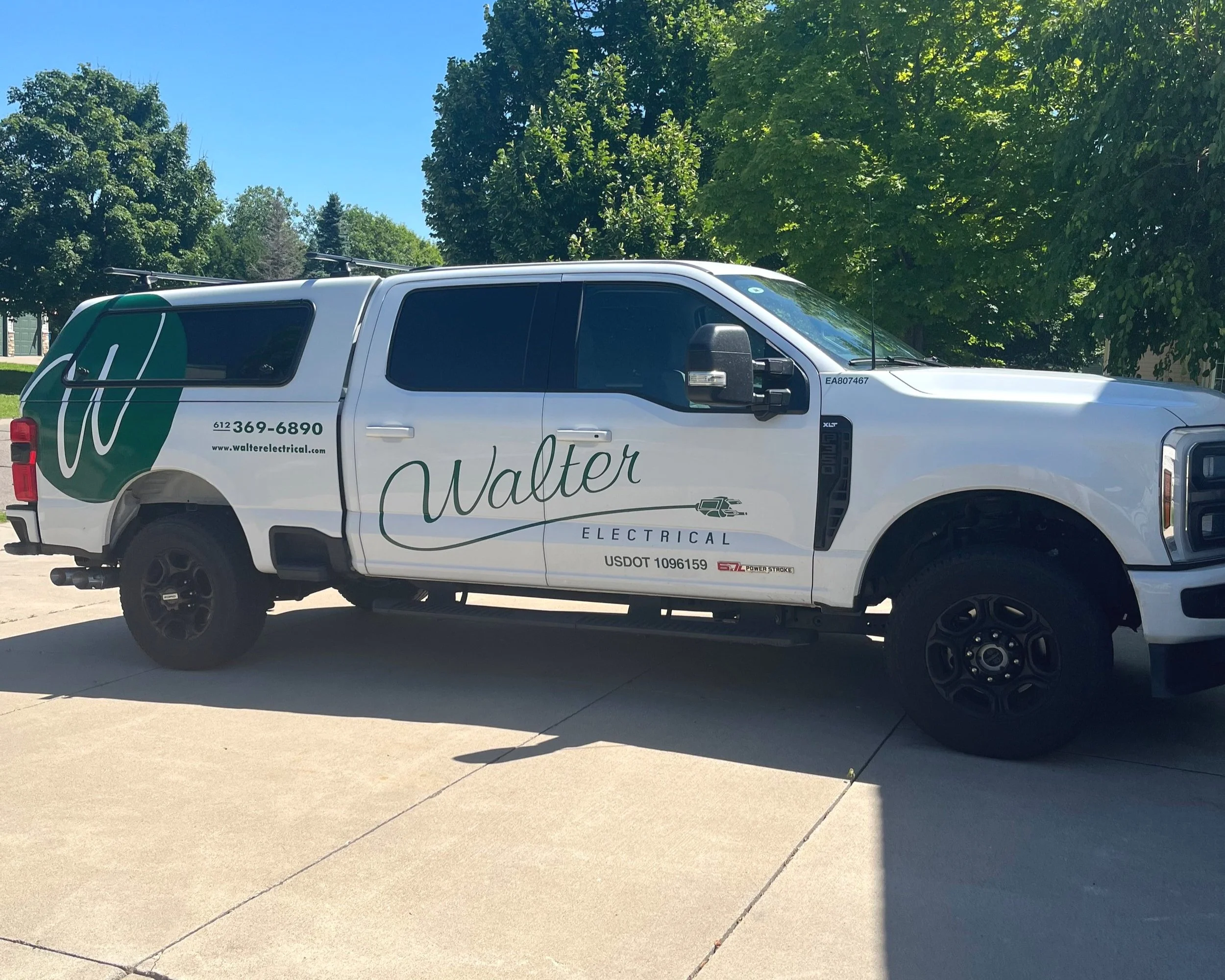 Walter Electrical Contractors service truck parked at company office at 10799 57th St NE, Albertville, MN 55301, serving residential and commercial electrical clients across Minnesota.