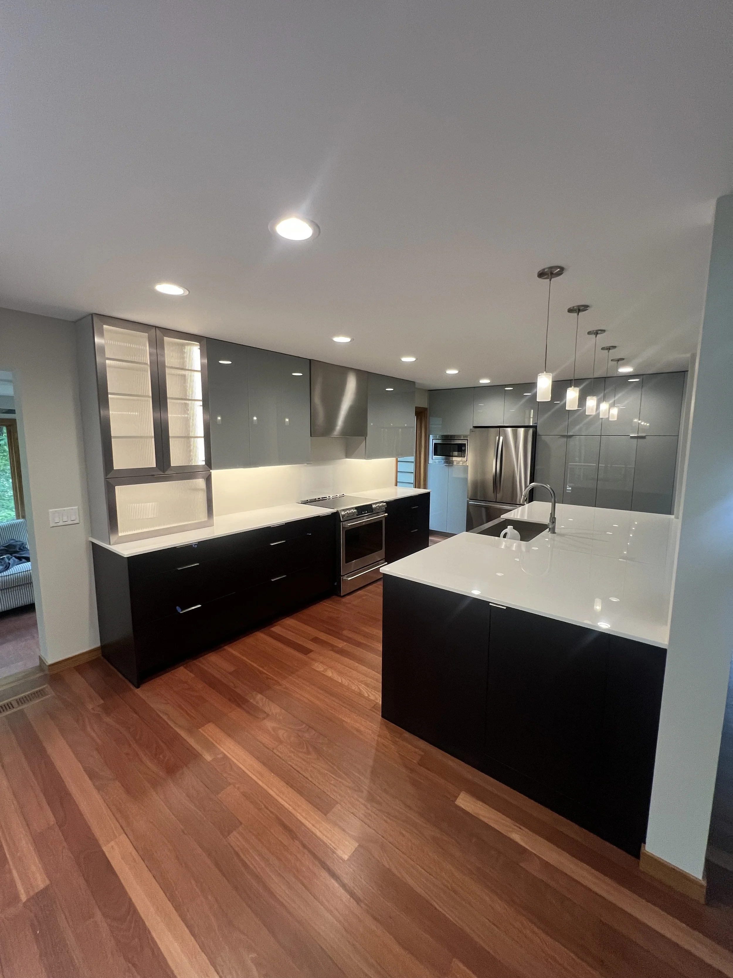 Modern kitchen remodel with electrical installed by Walter Electrical featuring pendant lighting, appliance hookups, and outlet placement in a Minnesota home.