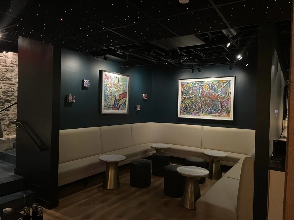 Commercial restaurant electrical install with custom ceiling lighting with starry effect and ambient wall fixtures installed by Walter Electrical Contractors in Minnesota for a cozy lounge space.