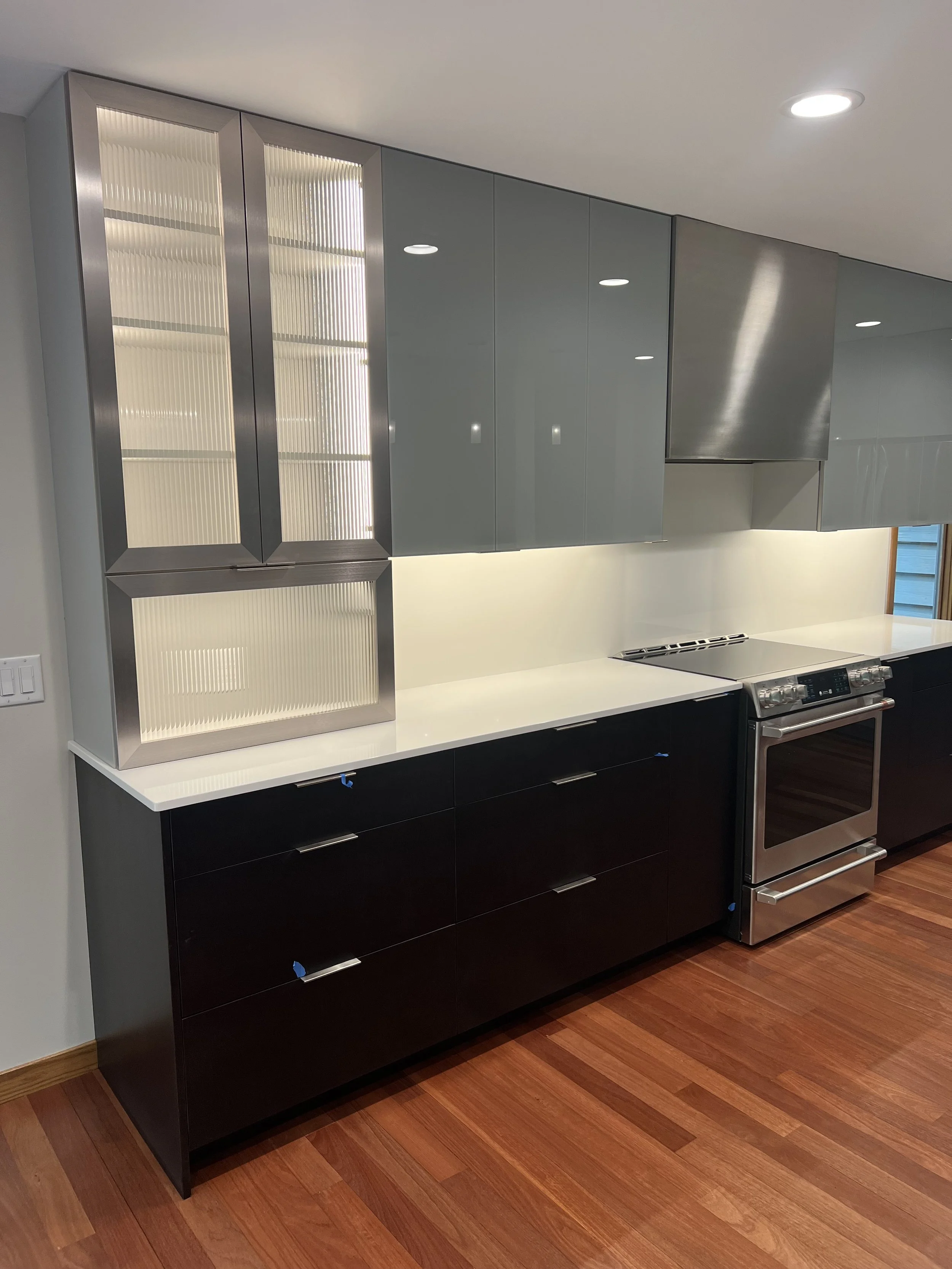 Electrical installation by Walter Electrical Contractors in Minnesota for a modern kitchen, including task lighting, outlet placement, appliance hookups, and under-cabinet lighting.