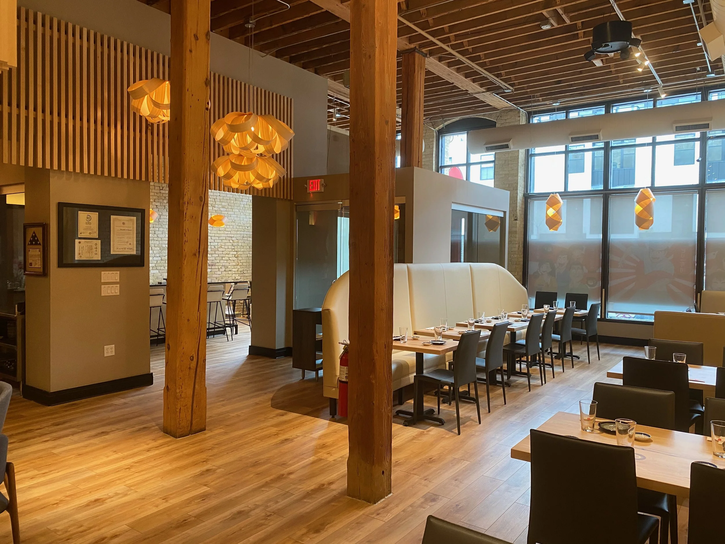 Commercial restaurant modern lighting installed by Walter Electrical Contractors in Minnesota, featuring pendant lights and ambient lighting throughout a modern restaurant dining area.