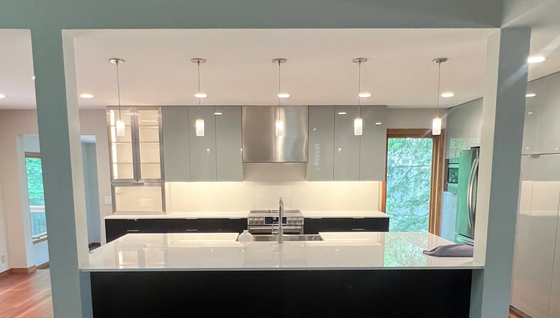 Modern kitchen remodel with electrical installed by Walter Electrical featuring pendant lighting, appliance hookups, and outlet placement in a Minnesota home.