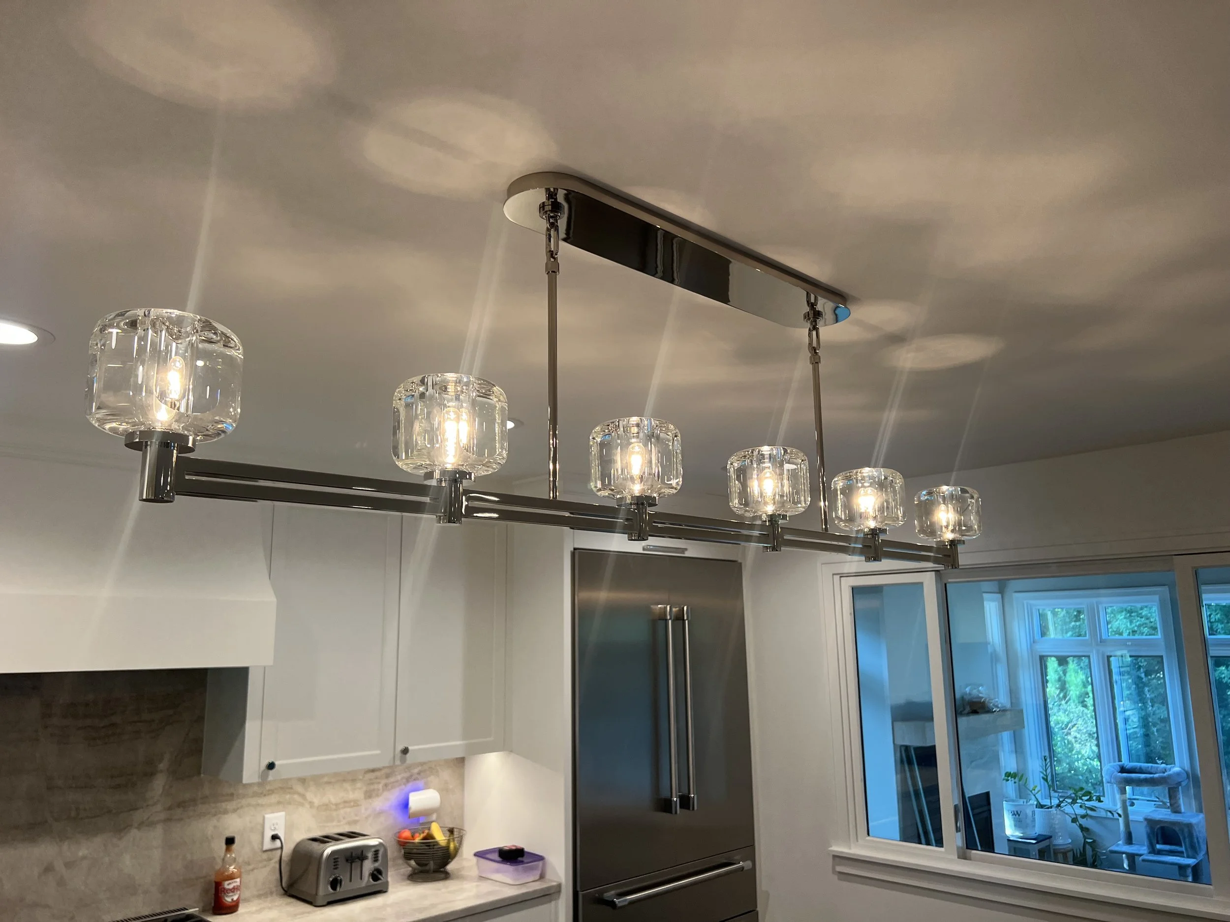 Modern glass bulb ceiling light fixture installed by Walter Electrical Contractors.
