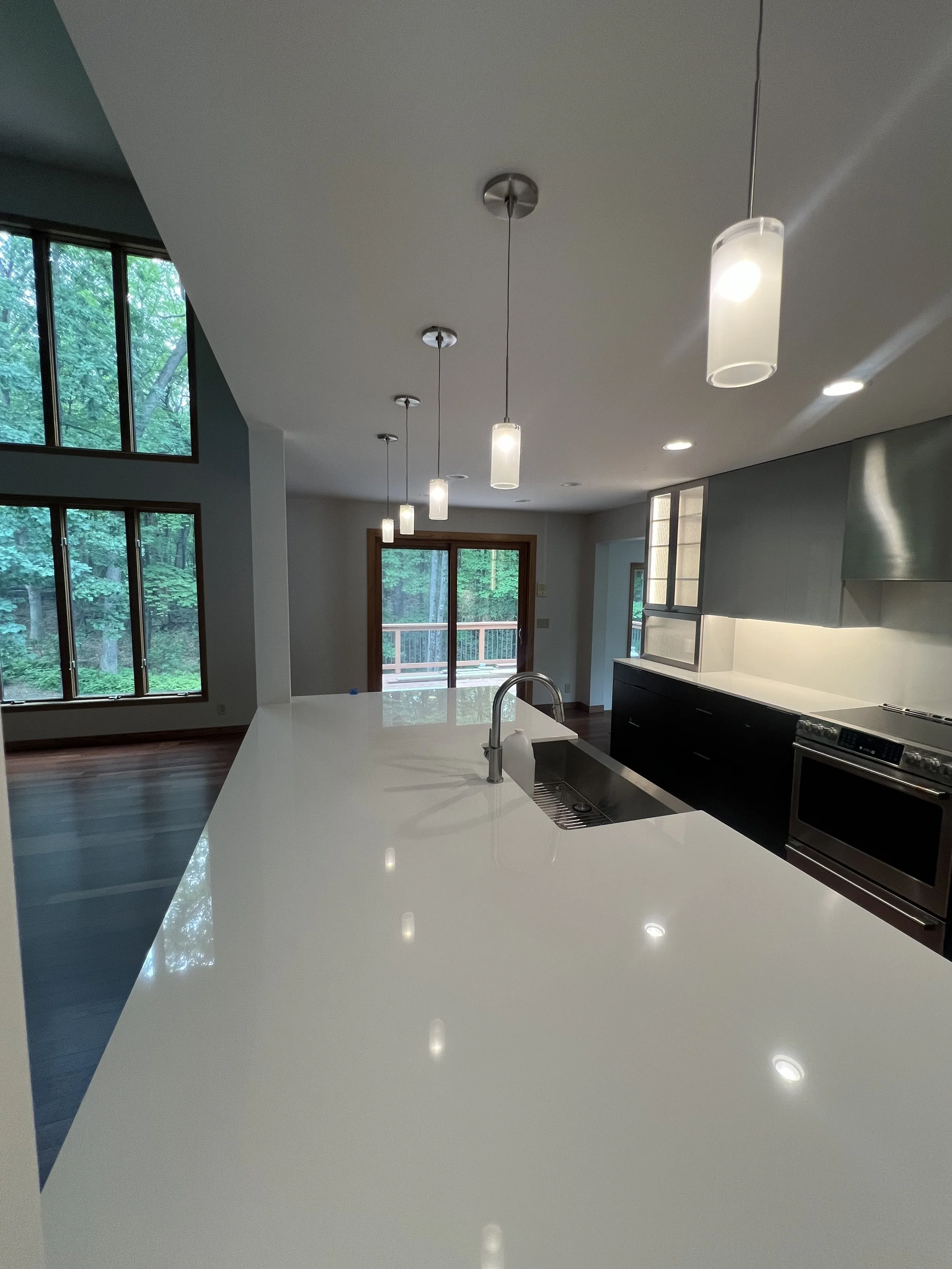 Modern kitchen remodel with electrical installed by Walter Electrical featuring pendant lighting, appliance hookups, and outlet placement in a Minnesota home.