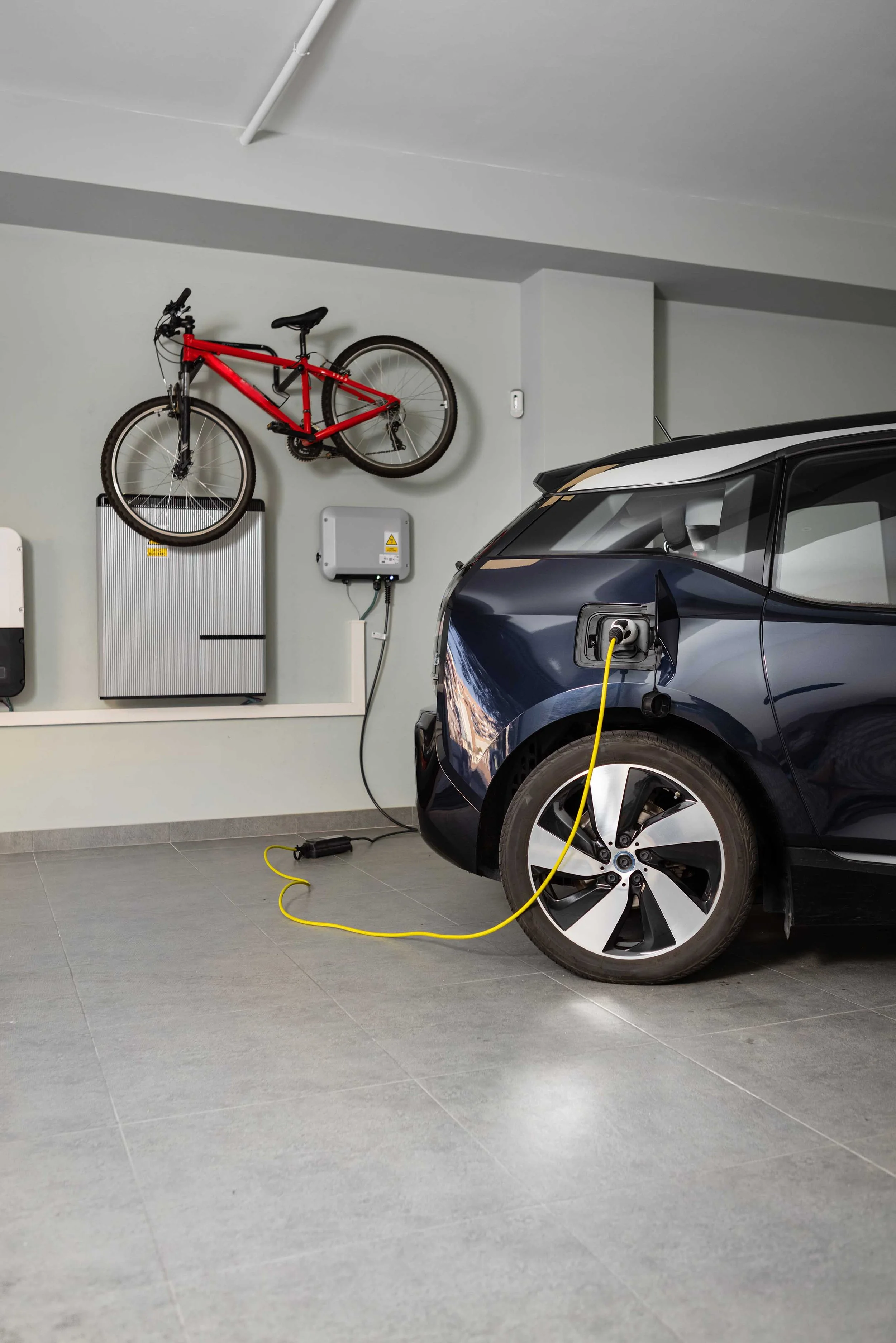 EV charger installation, powering an electric vehicle with clean energy solutions, showing that Walter Electrical installs electric vehicle chargers for residential and commercial properties