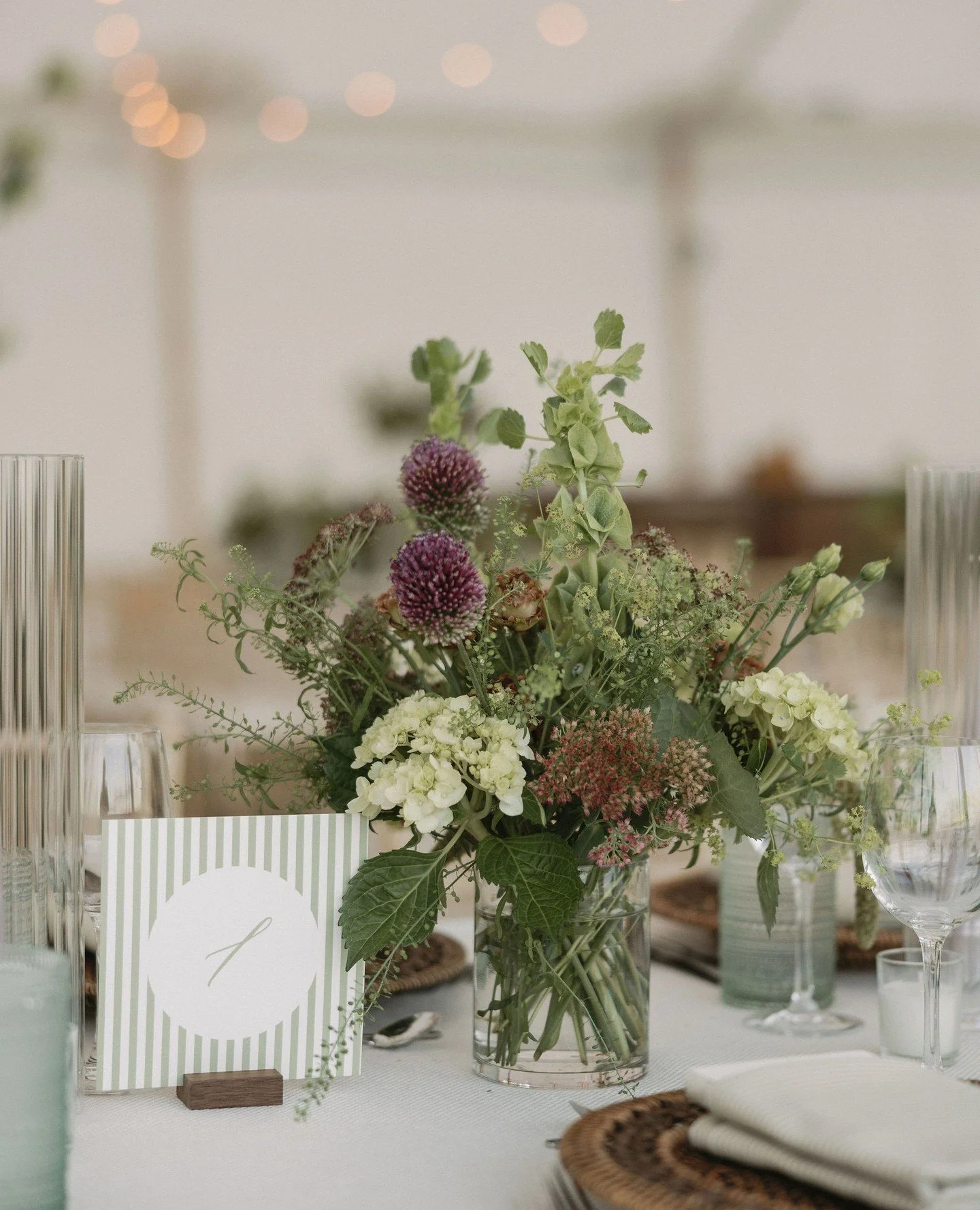I love how the stripe envelope liner from this invitation became a design element at the celebration... So fun!⁠