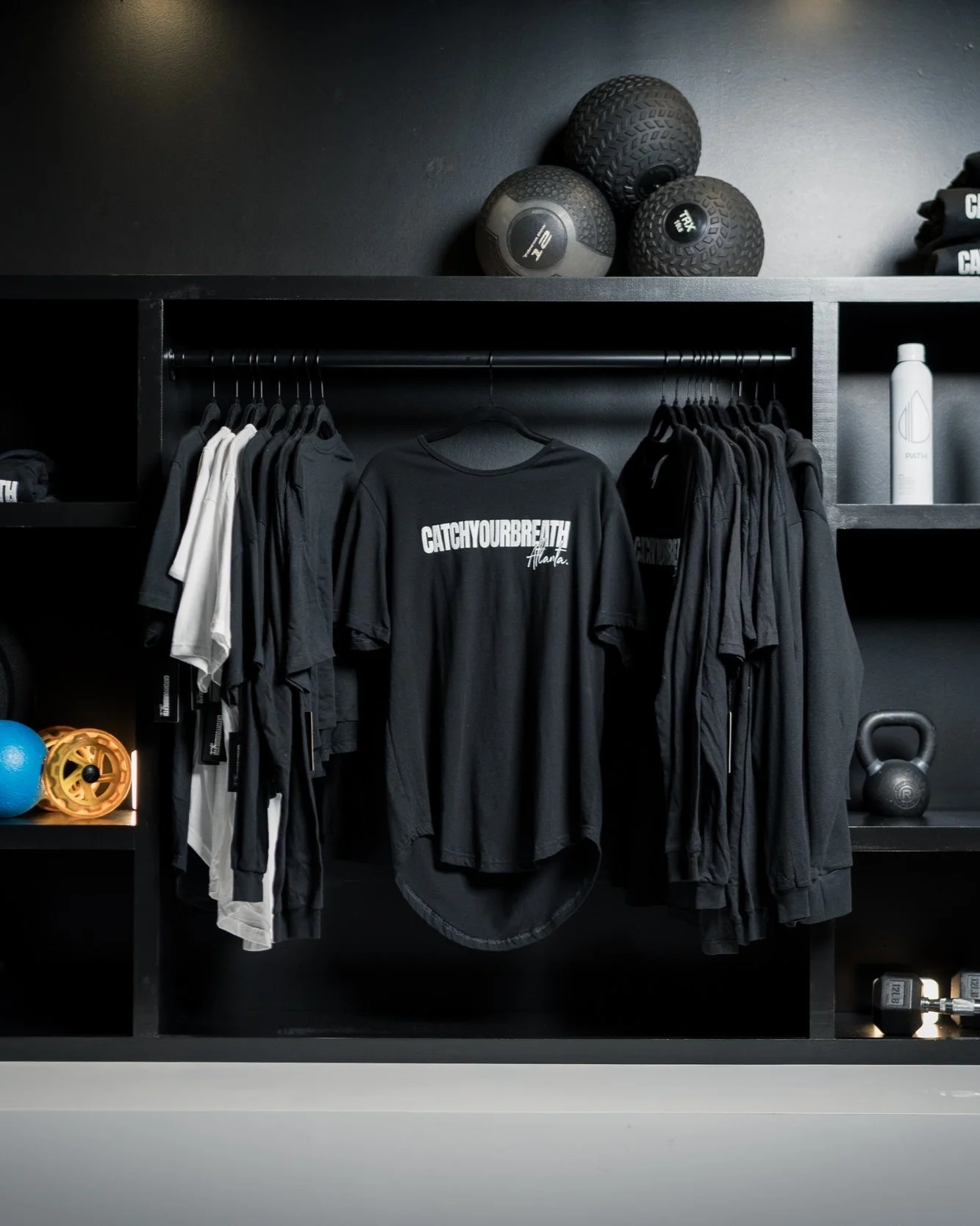 A calm, intentional entry space designed for reset and readiness. Stocked with towels, curated merch, and room to stretch, breathe, or recover before and after your session.
