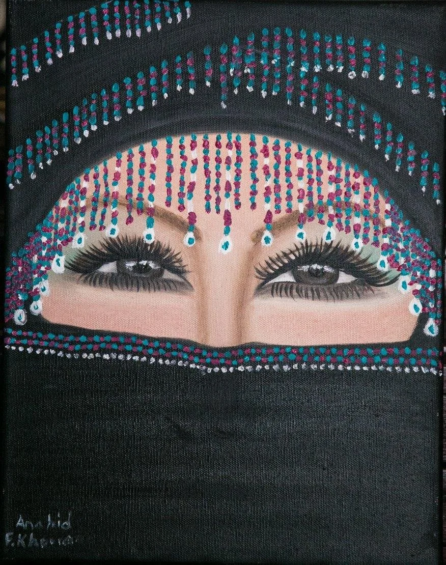 Portrait of a woman with dark eye makeup, peering out from a black fabric covering her head and lower face, surrounded by colorful bead and jewel ornamentation.