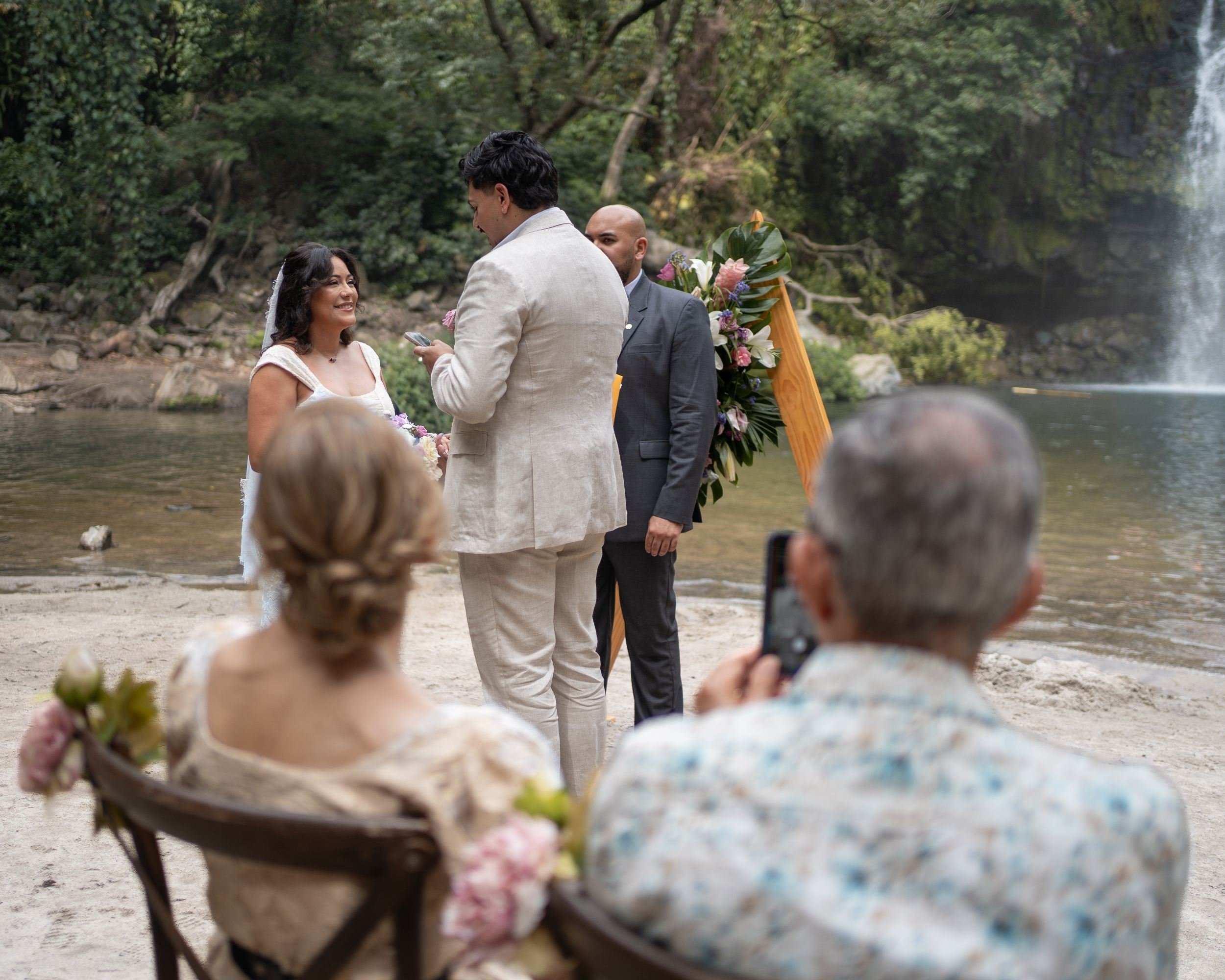 Micro wedding ceremony in Llanos del Cortes Costa Rica with seated guests capturing the moment