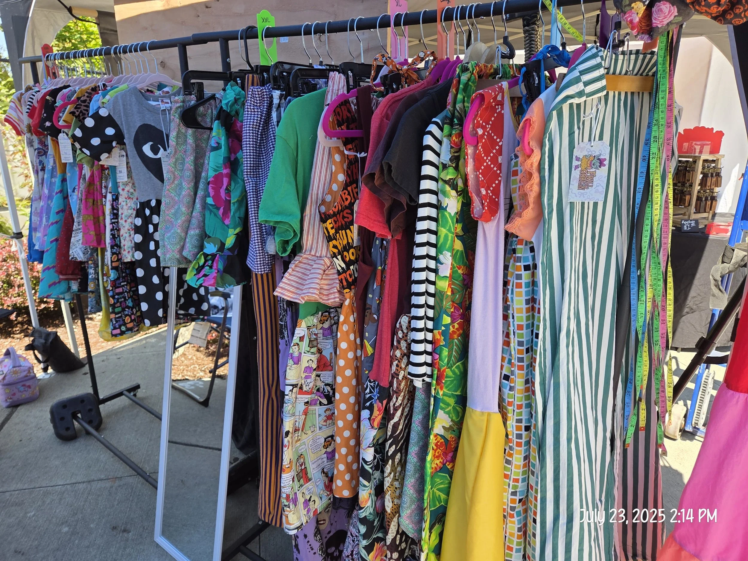 Farmers market clothing rack with upcycled and refashioned clothing