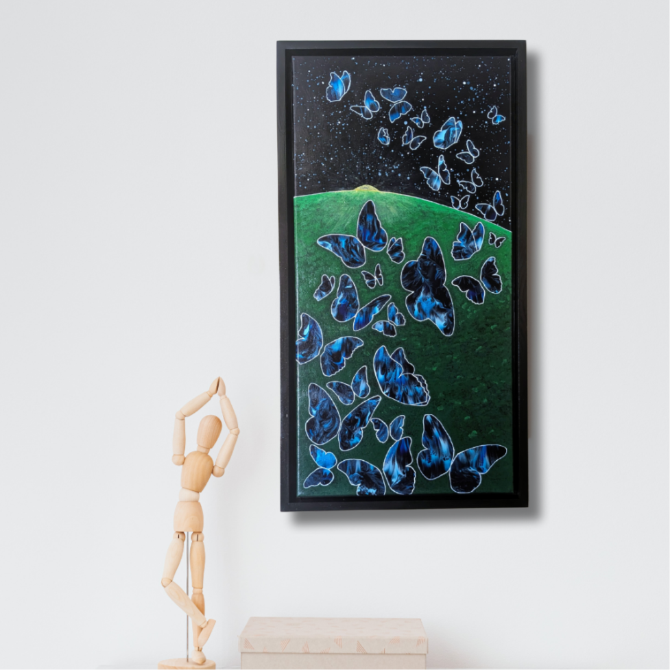 12x24 framed acrylic painting of glowing blue butterflies rising from a green hill into a dark starry night sky