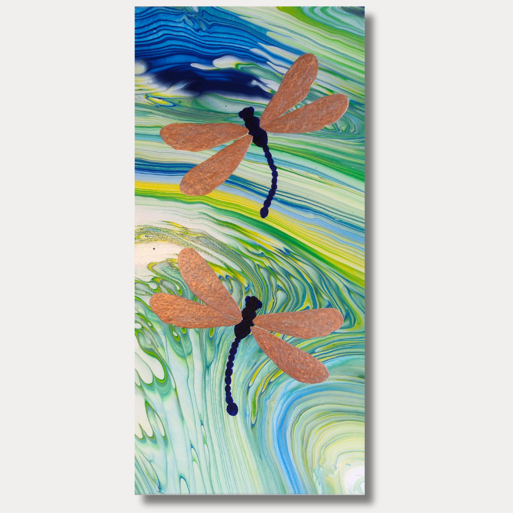 10x20 acrylic painting of two dragonflies with warm-toned wings over a blue and green flowing abstract background