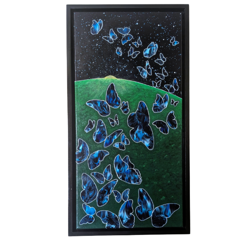 12x24 framed acrylic painting of glowing blue butterflies rising from a green hill into a dark starry night sky