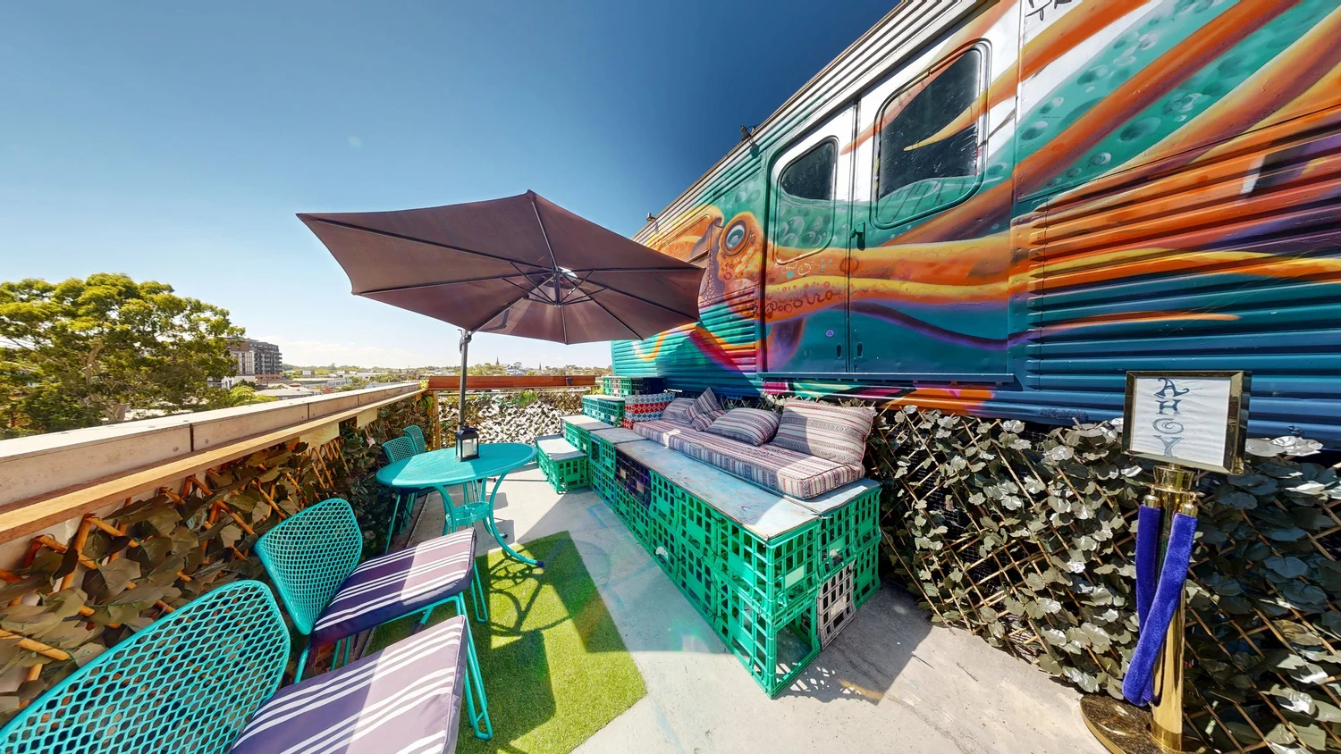 Trainscendence rooftop with two themed train carriages — creative event venue in Collingwood, Melbourne