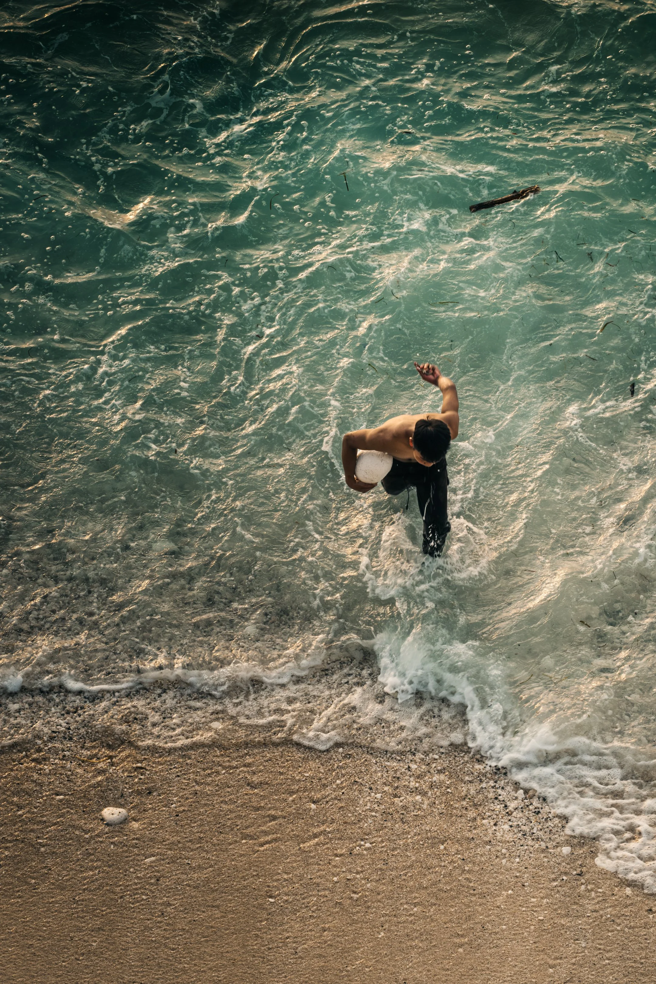 Volleyball amidst the waves.