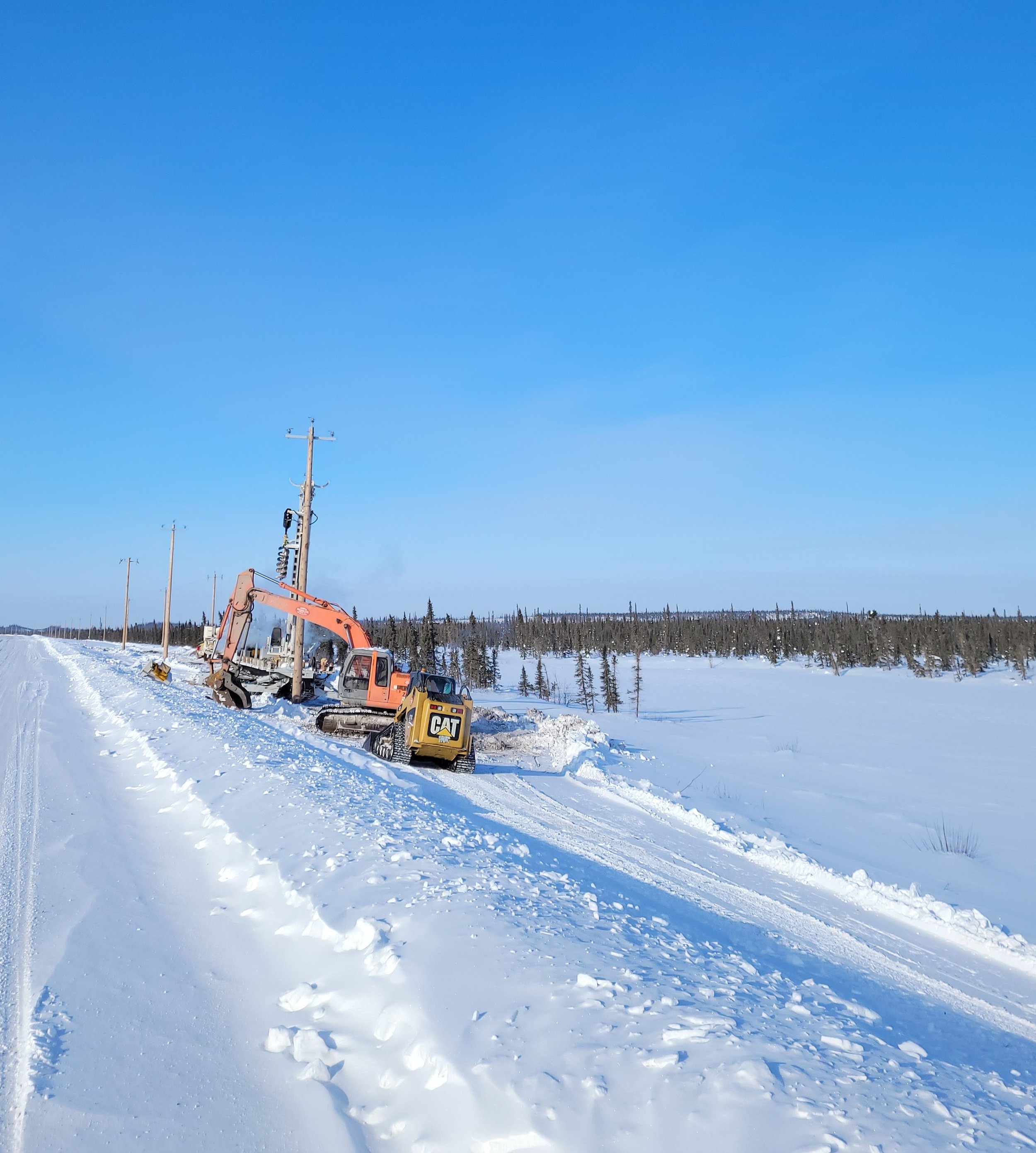 Installation on the distribution line connecting the wind turbine to the rest of the local electricity system continued throughout the winter of 2022/23