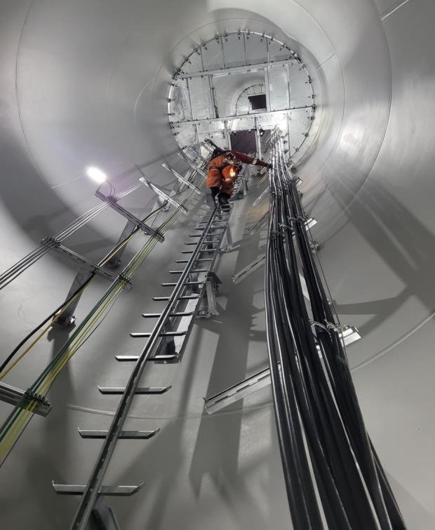 With the large components installed, work on support infrastructure such as wiring began