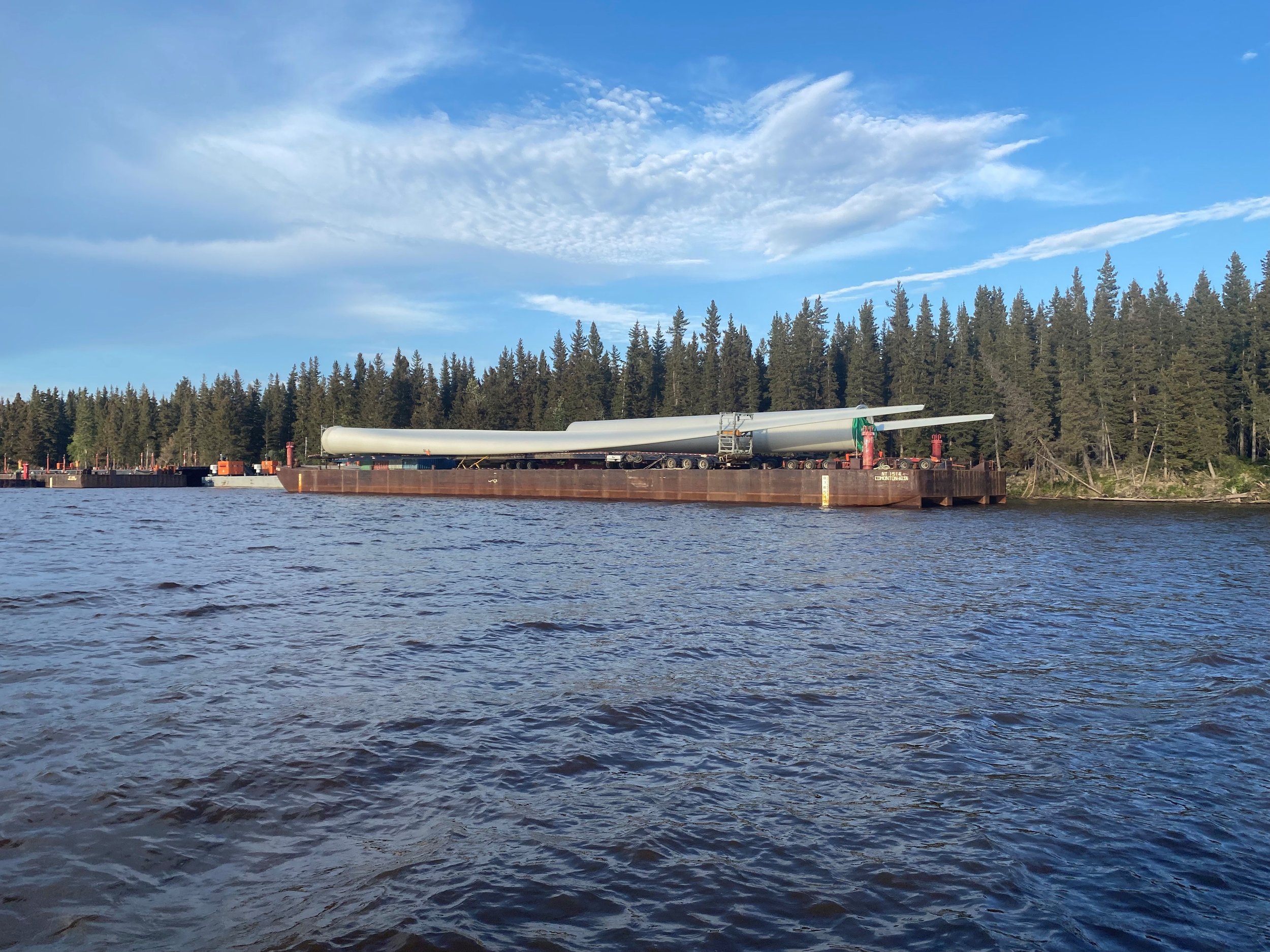 The wind turbine blades were transported by barge from Hay River to Inuvik in the summer of 2022 