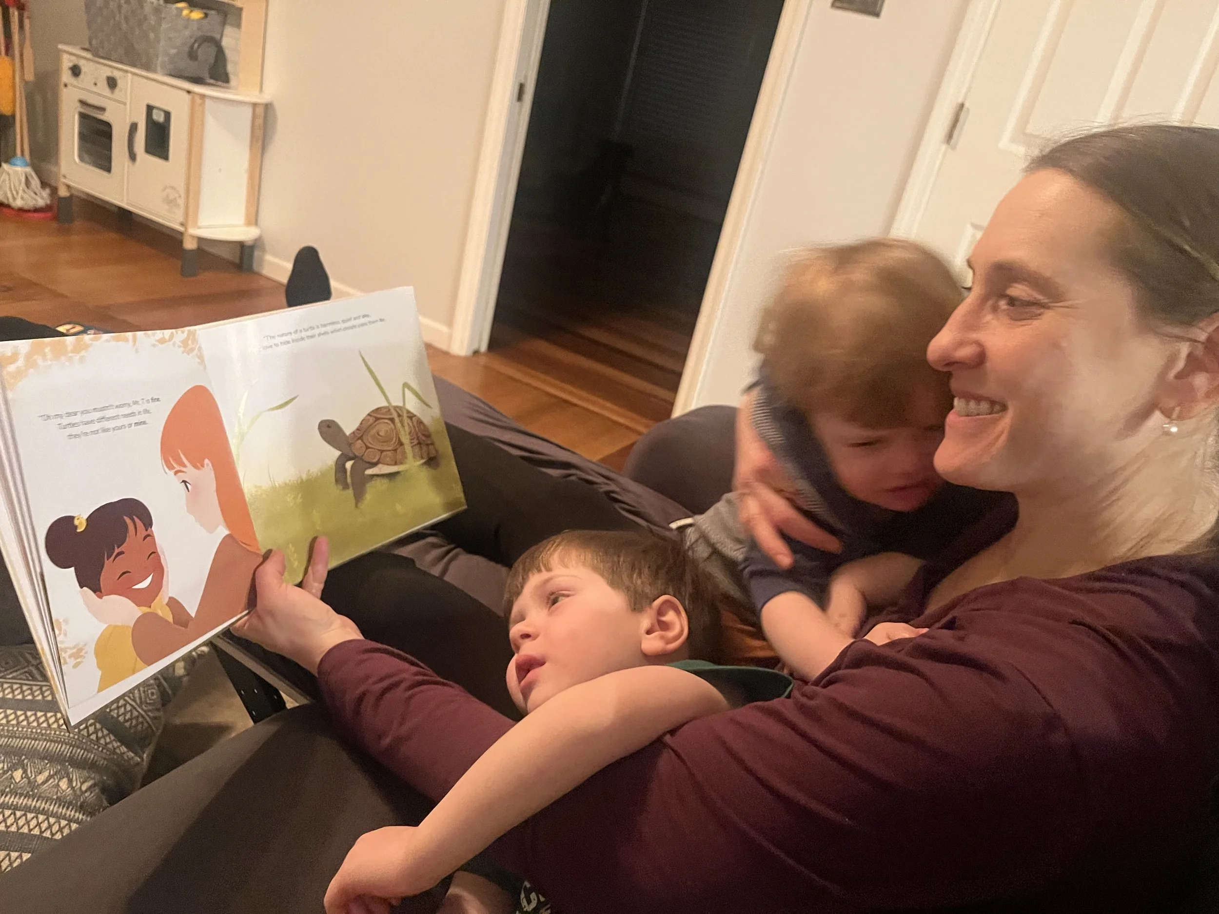 mom and boys reading