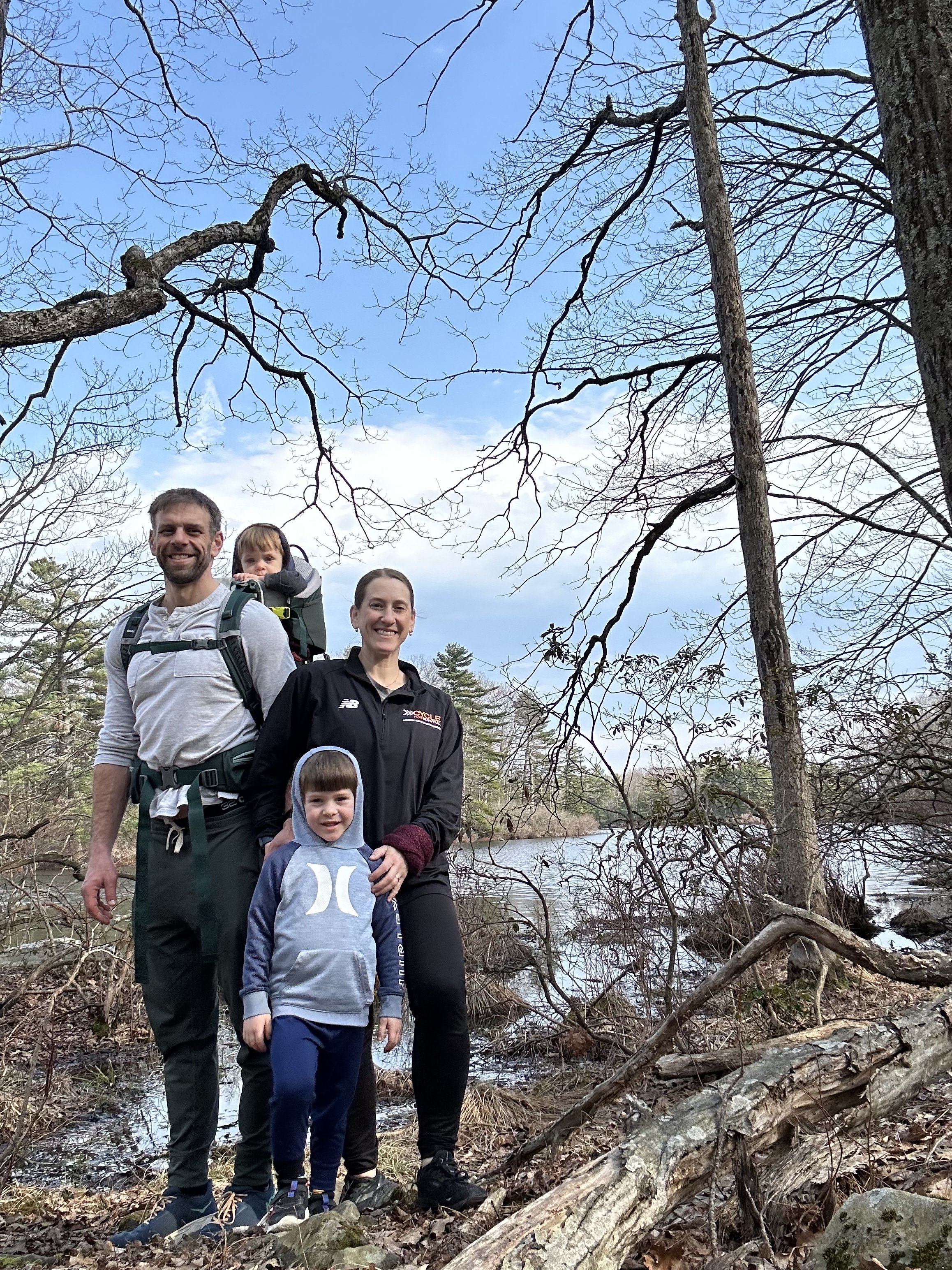 family on hike near lake