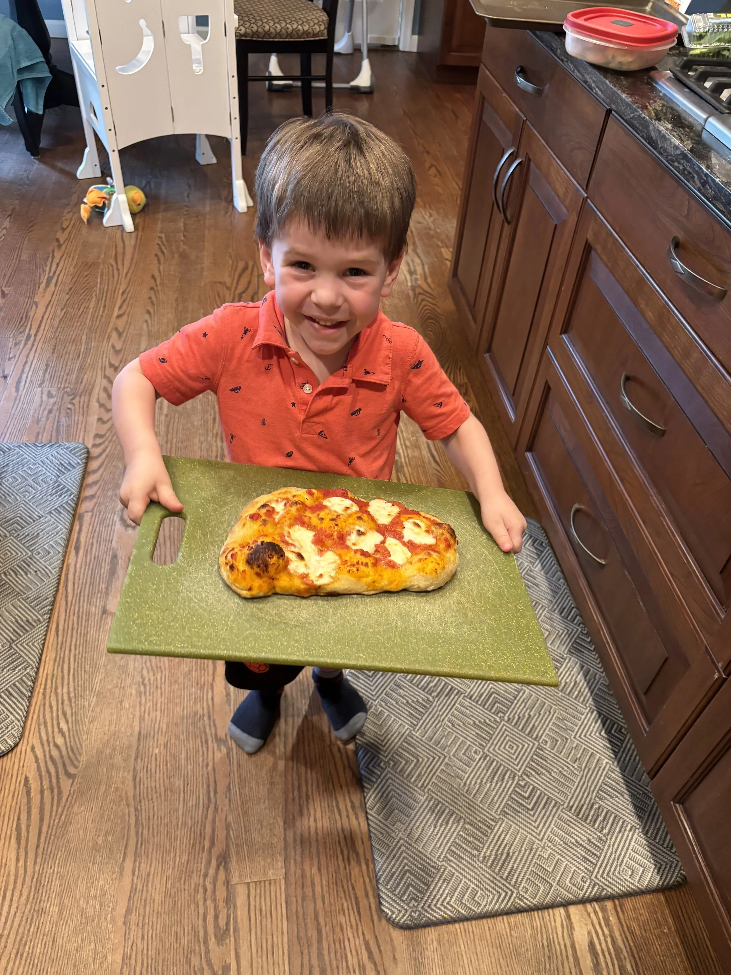 Boy proud of pizza