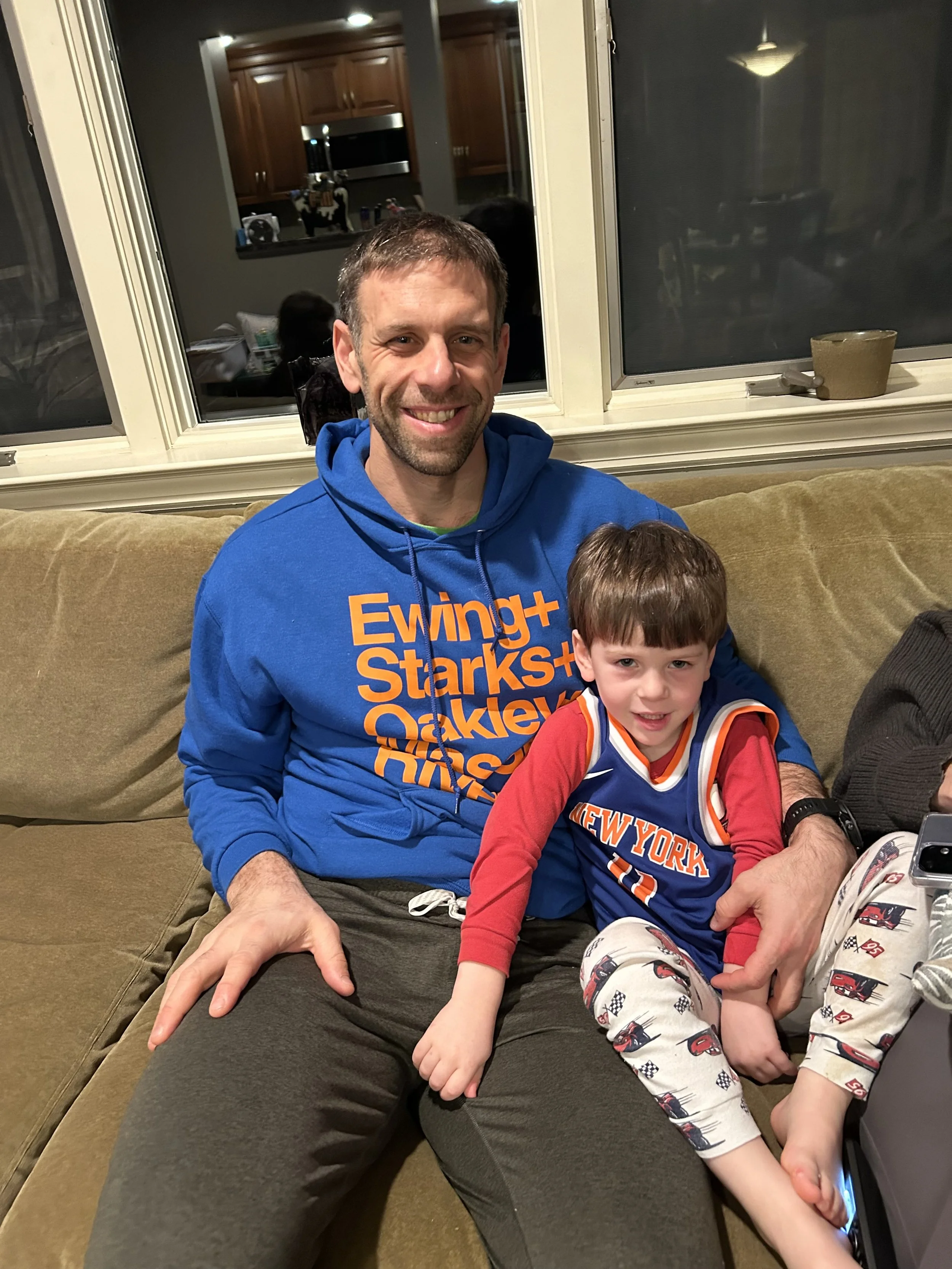 Dad and son in Knicks gear