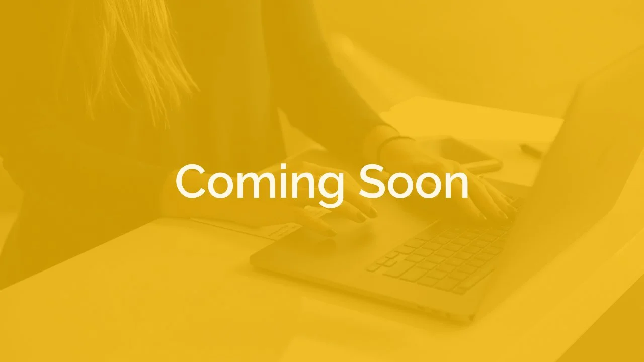 Yellow image of women typing on laptop with "Coming Soon" overlayed on top