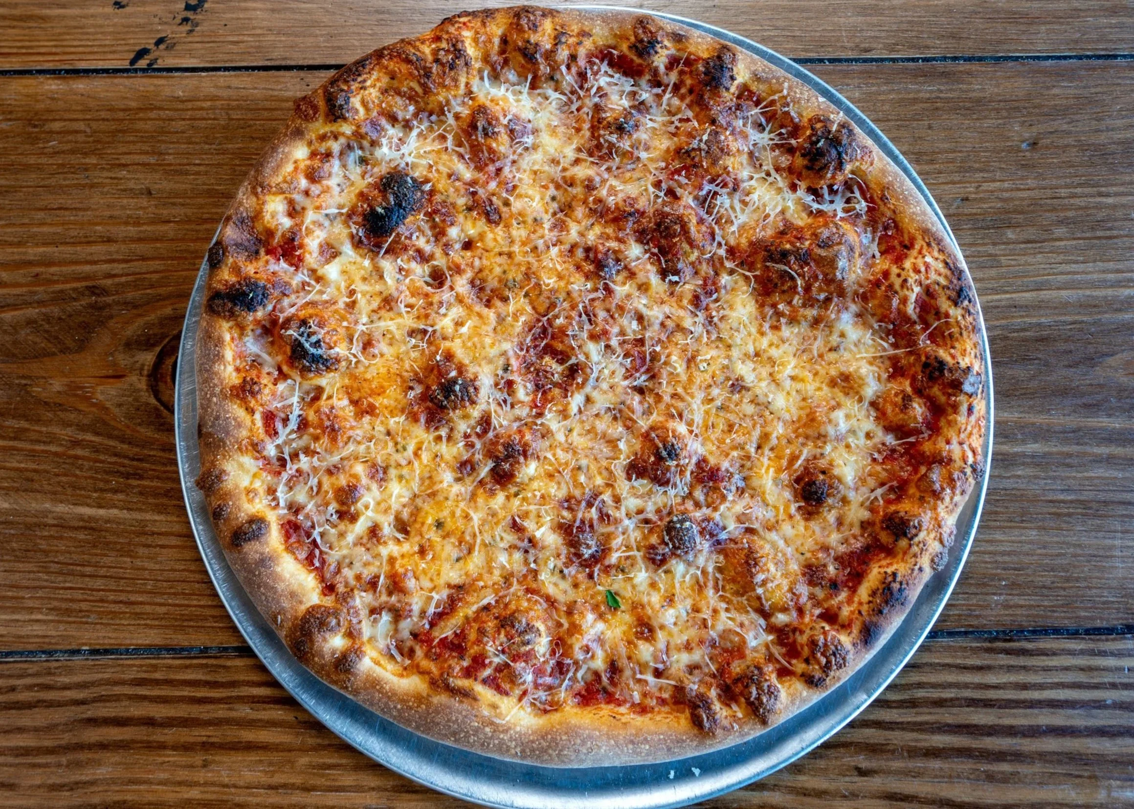 16" pizza pie with mozarella cheese, house made tomato and basil red sauce base, on sourdough crust with mozarella and aged provolone finishing cheese.