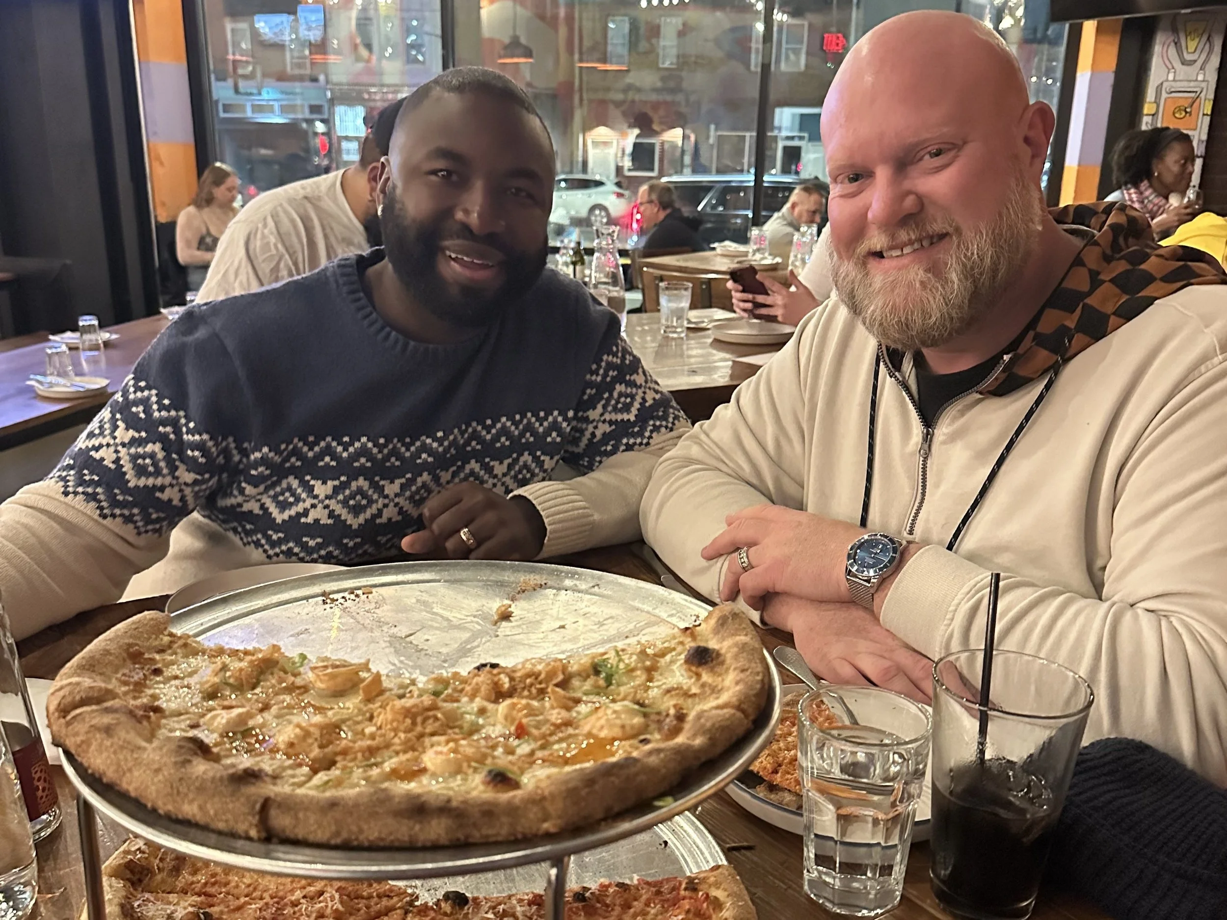 Photos of couples eating pizza, groups eating fresh house made pasta, menus and upcoming events