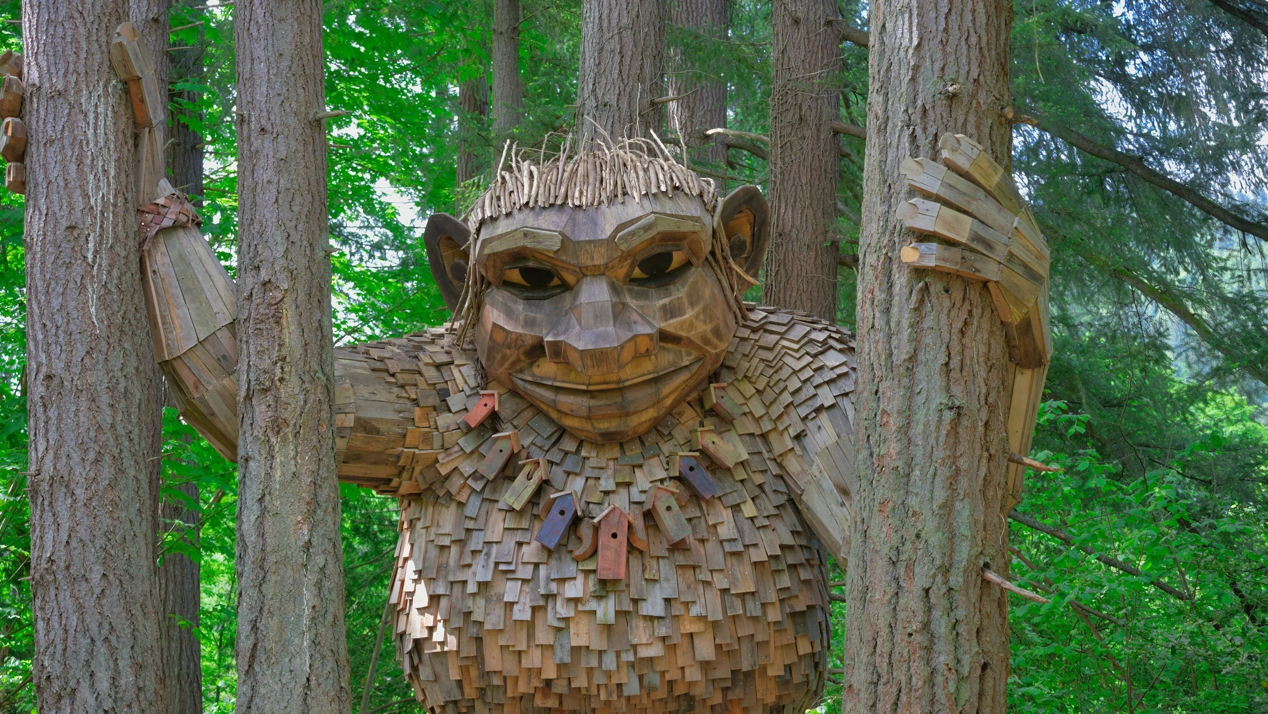 Contemporary outdoor sculpture among trees and meadow